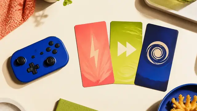 Blue controller beside three colorful game mood cards